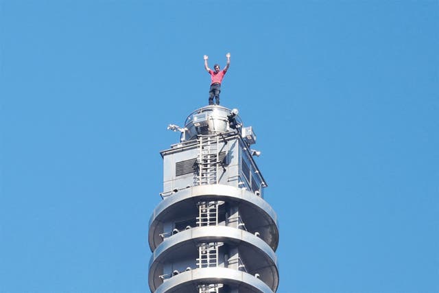 <p>US rock climber Alex Honnold raises his arms from the top of the Taipei 101 building after he successfully free soloed the landmark skyscraper without ropes or safety gear in Taipei on January 25, 2026</p>
