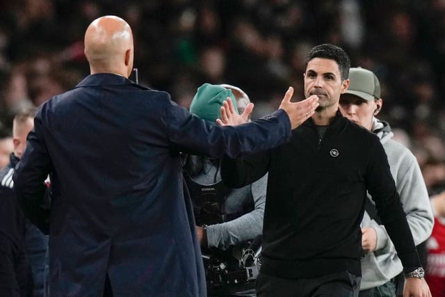 <p>Mikel Arteta and Arne Slot shake hands (Alastair Grant/AP)</p>