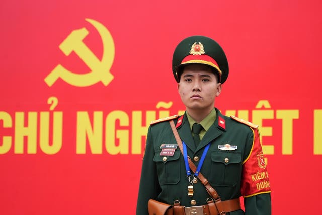 <p>A security officer guards the entrance ofthe National Convention Center during the week-long Congress of the Communist Party of Vietnam in Hanoi.</p>
