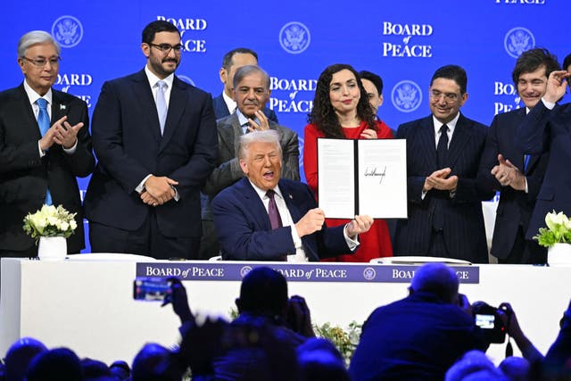 <p>US President Donald Trump holds a signed founding charter at the ‘Board of Peace’ meeting during the World Economic Forum (WEF) annual meeting in Davos</p>