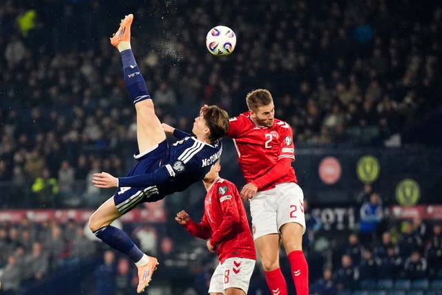 <p>Scotland’s Scott McTominay scores the opening goal during the win over Denmark (Andrew Milligan/PA)</p>