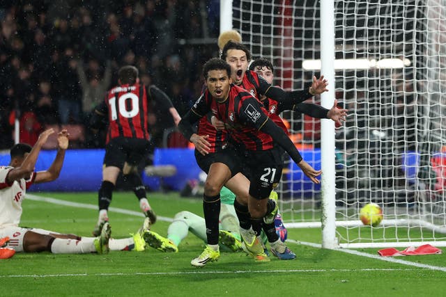 <p>Amine Adli wheels away after scoring a late winner against Liverpool</p>