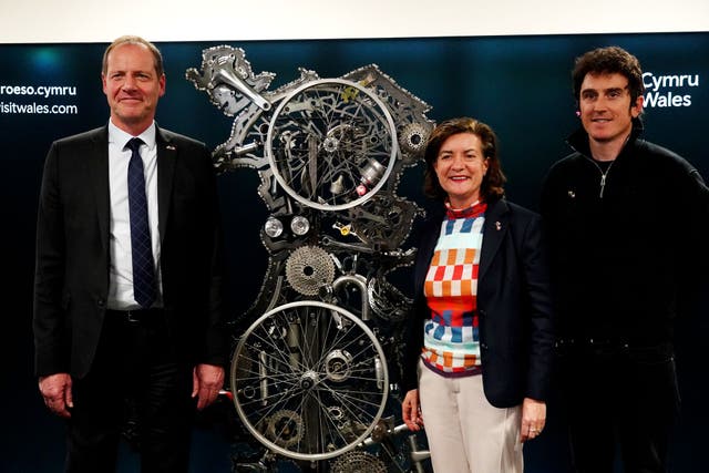 <p>First minister of Wales Eluned Morgan (centre), Tour de France 2018 winner Geraint Thomas (right), and director of the Tour de France Christian Prudhomme during the Tour de France 2027 Grand Depart route reveal at the Senedd in Cardiff</p>
